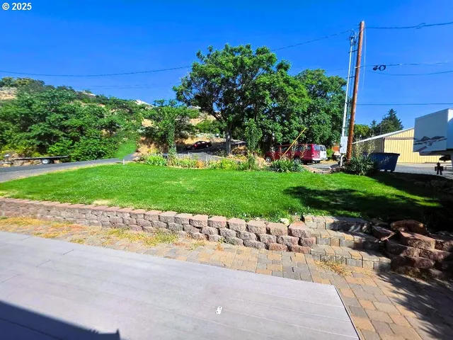 a spacious bathroom with a granite countertop sink and a mirror