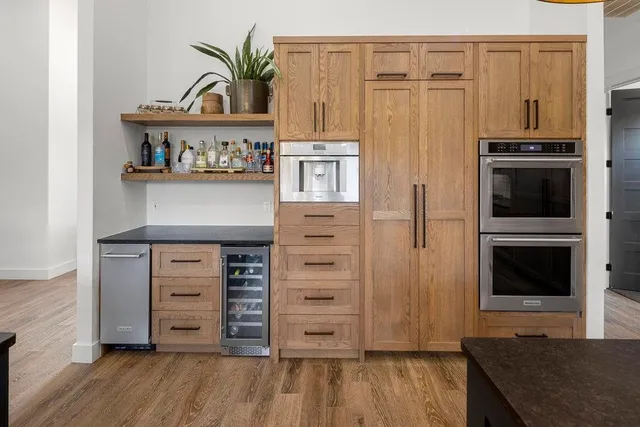 a kitchen with stainless steel appliances a stove and a refrigerator