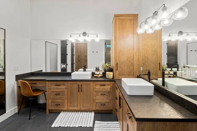 a bath room with a sink and a mirror