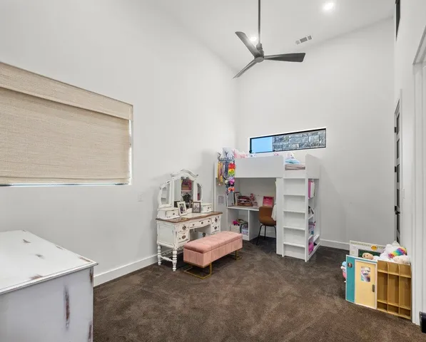 a room that has a bed and a table in it