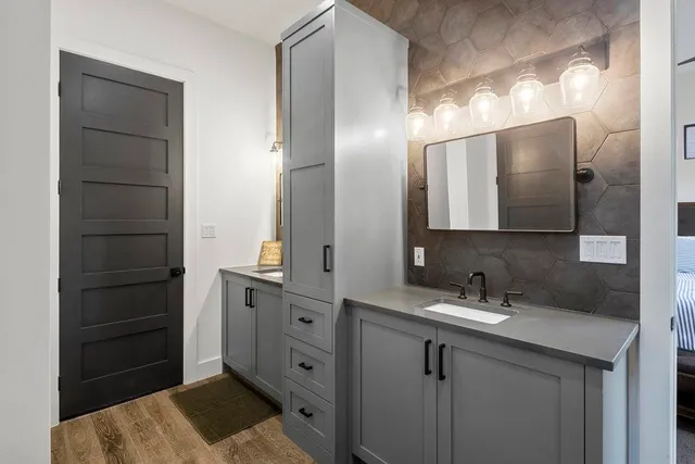 a bathroom with a sink and a mirror