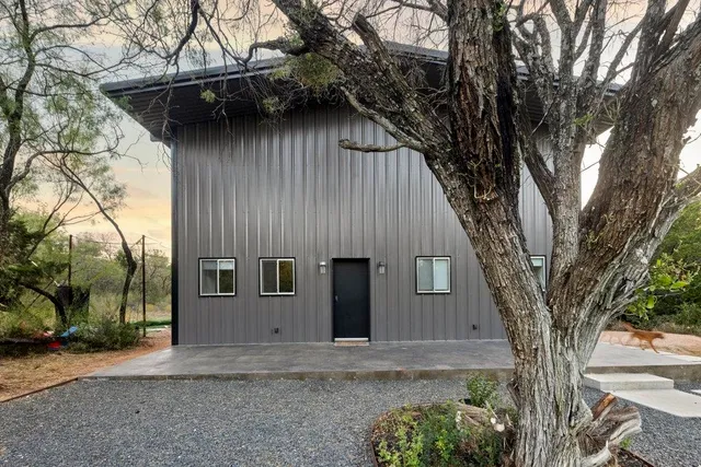 a house with trees in front of it