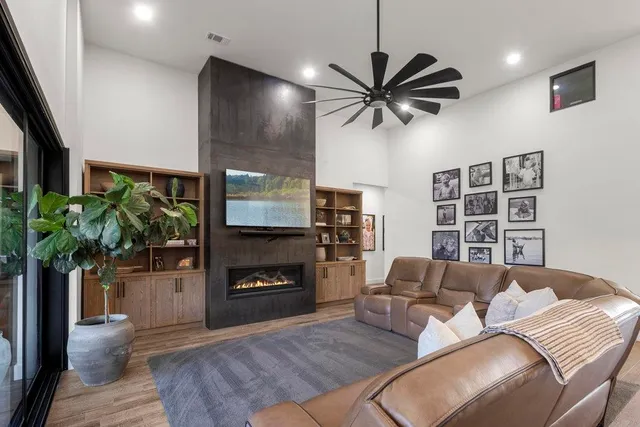 a living room with furniture and a fireplace