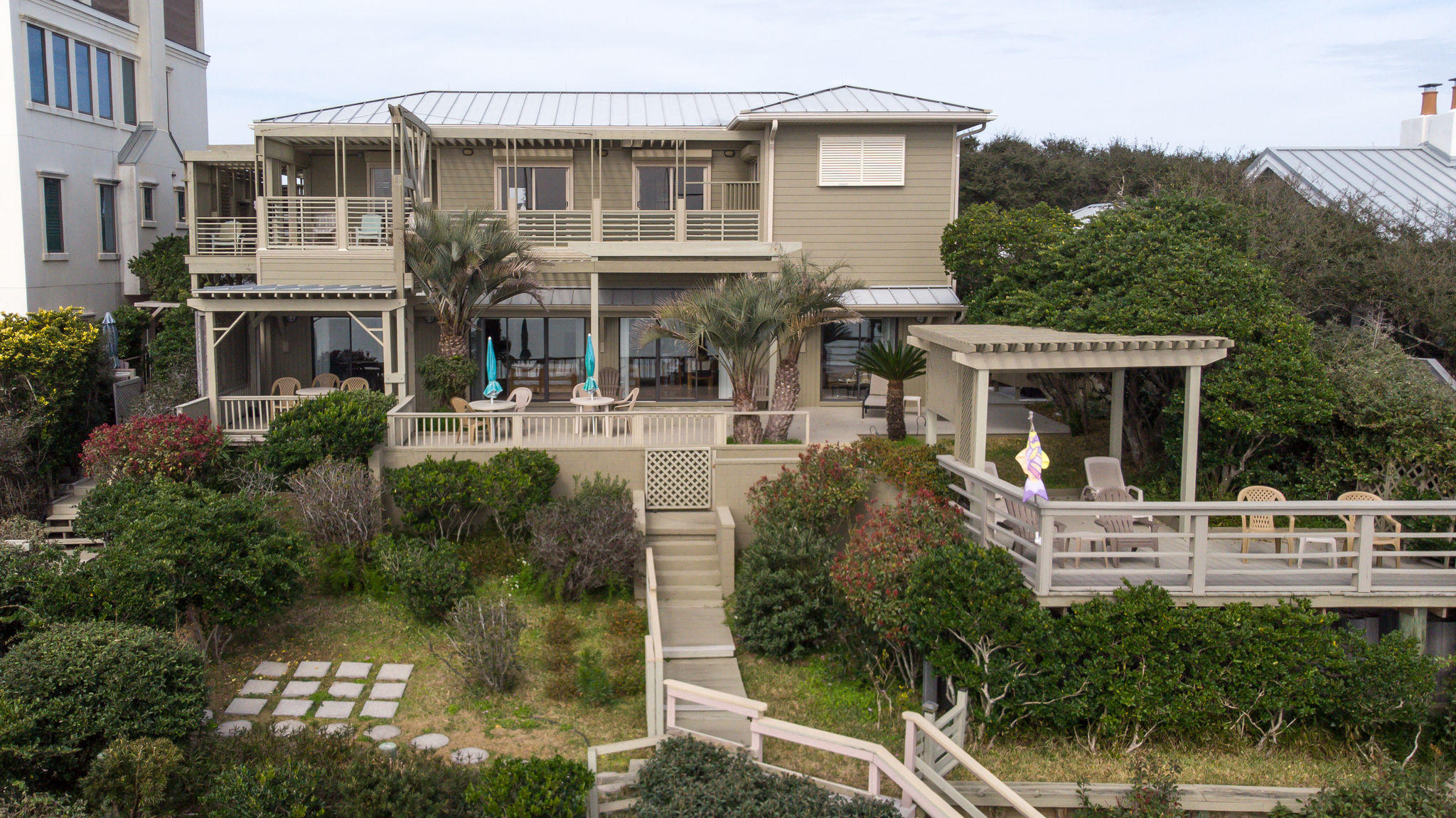 a view of a house with balcony and garden