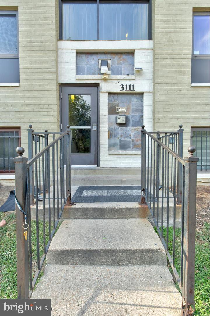 3111 Naylor Road Southeast, Unit 301 Washington, DC 20020 - Photo 2 of 11 a view of entrance gate of building