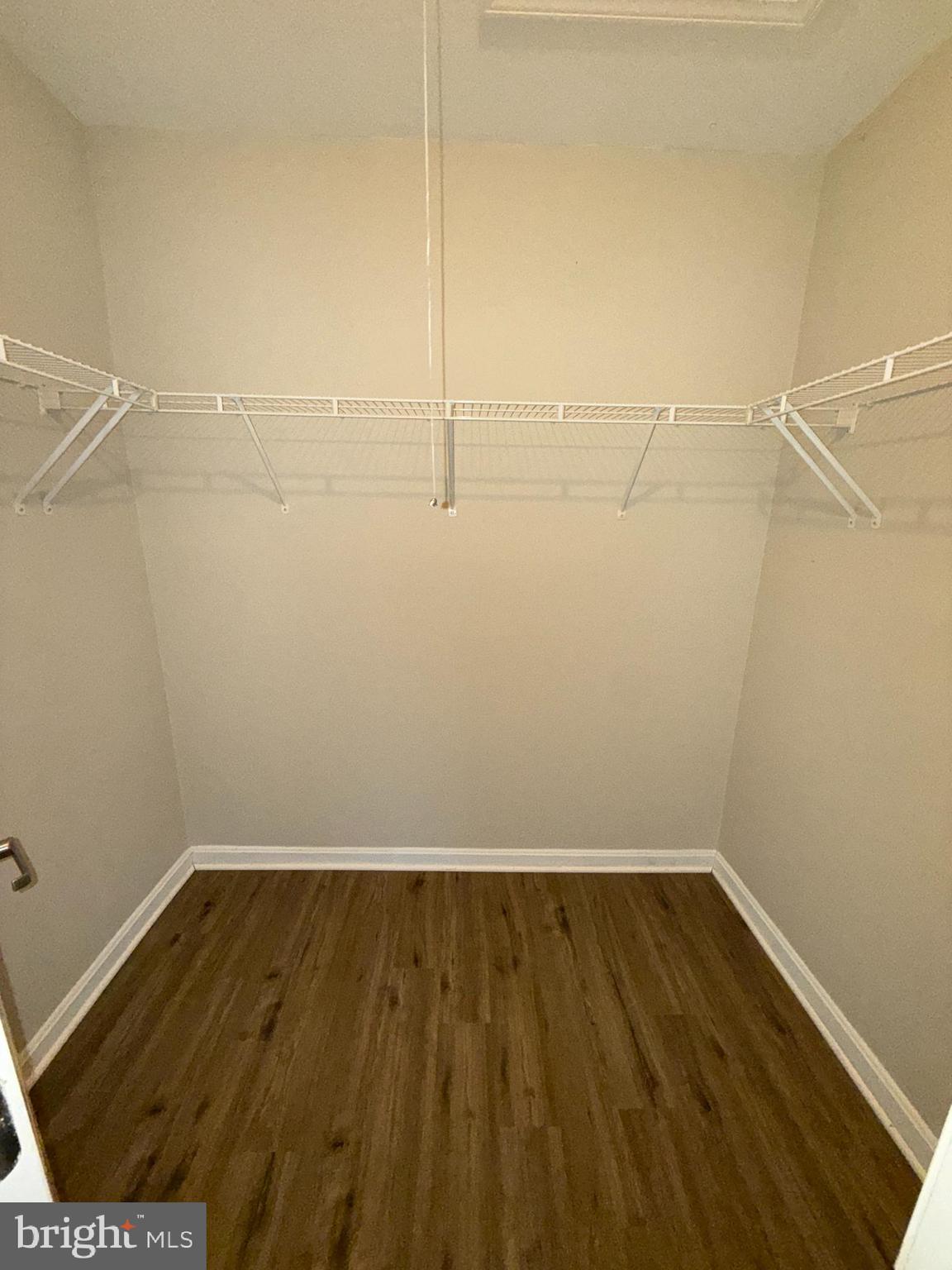 3111 Naylor Road Southeast, Unit 301 Washington, DC 20020 - Photo 7 of 11 a view of a room with wooden floor