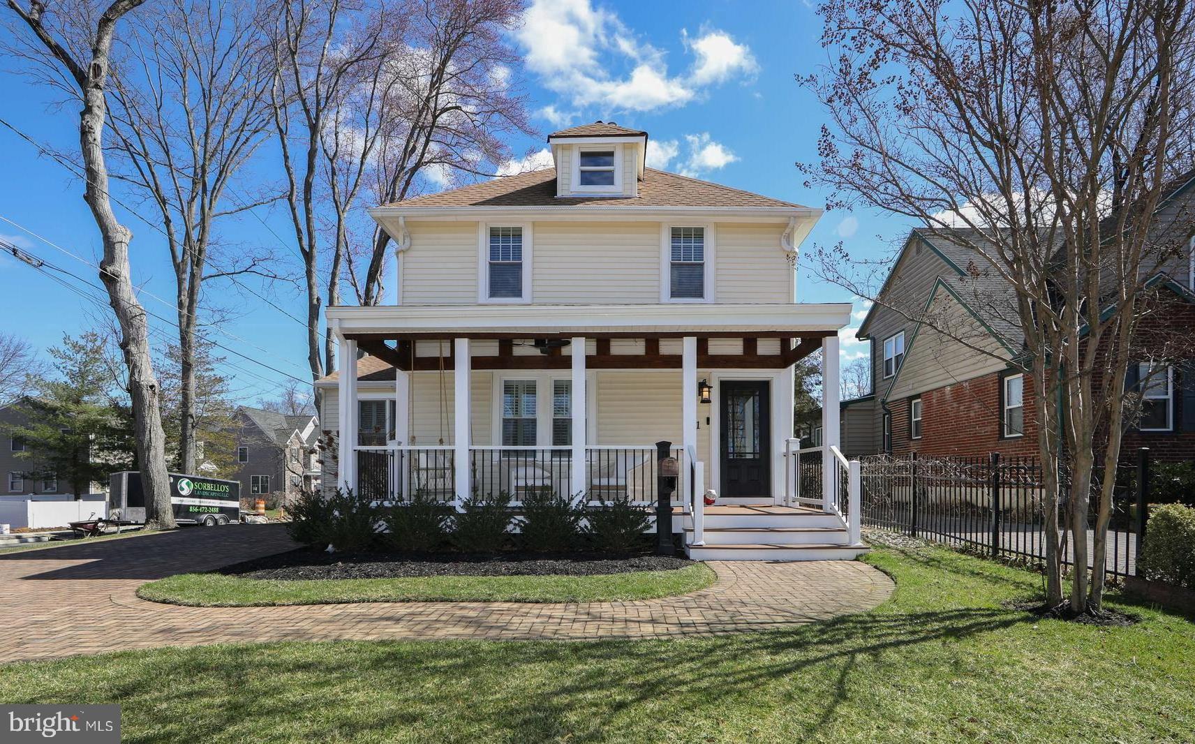 401 Spruce Street Haddonfield, NJ 08033 - Photo 2 of 40 a front view of a house with a yard