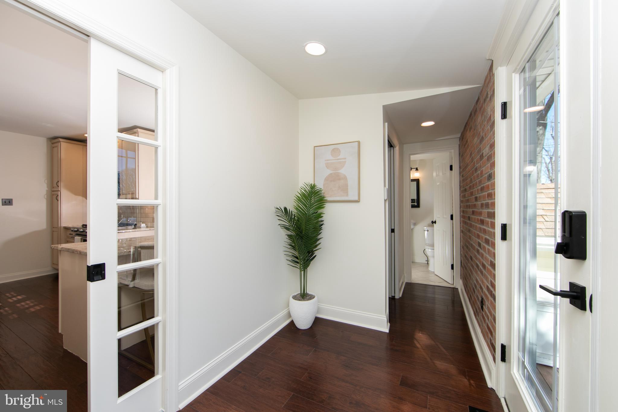 401 Spruce Street Haddonfield, NJ 08033 - Photo 21 of 40 a view of a hallway with wooden floor and entryway