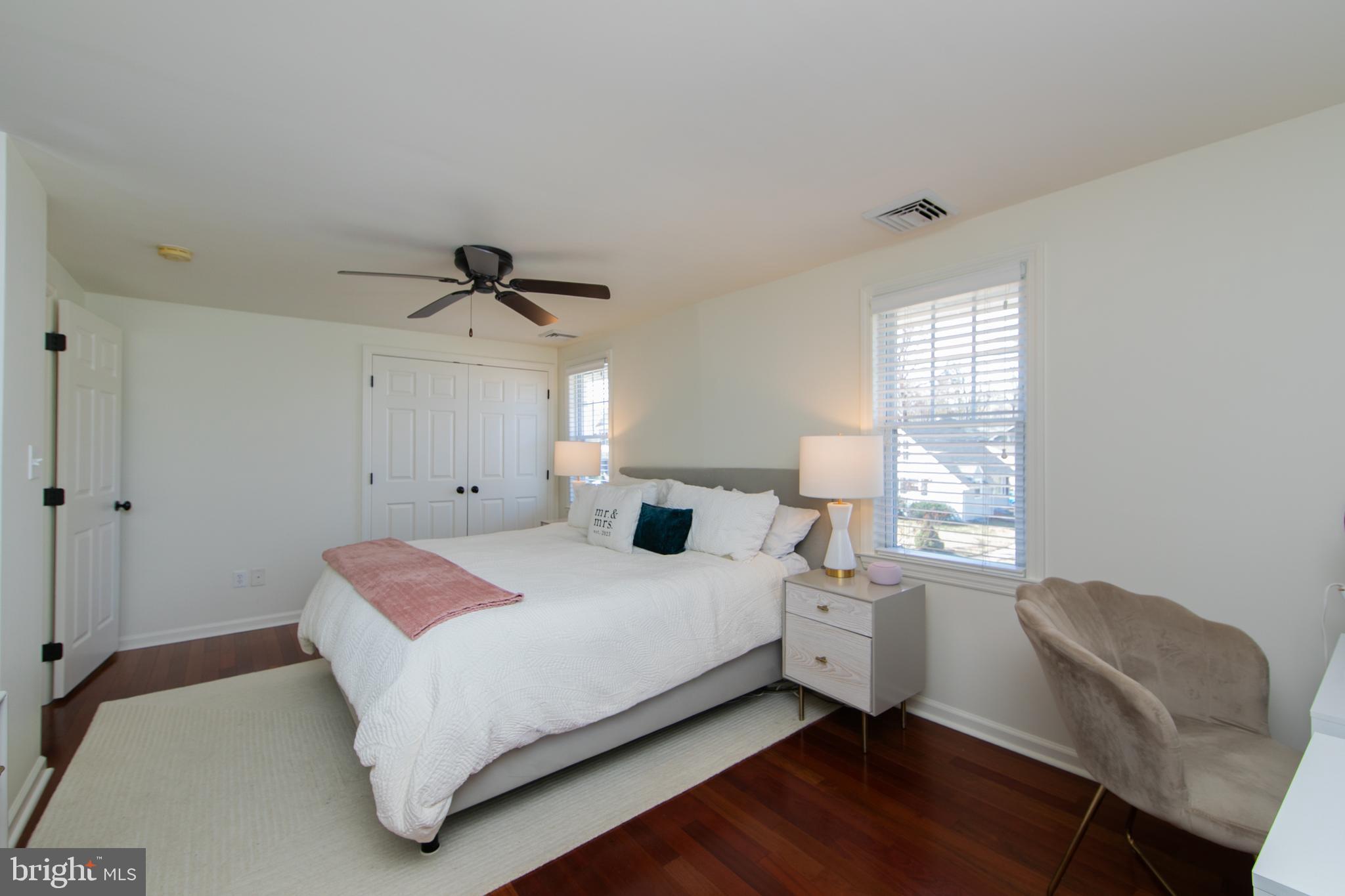 401 Spruce Street Haddonfield, NJ 08033 - Photo 25 of 40 a bedroom with a bed and a chair