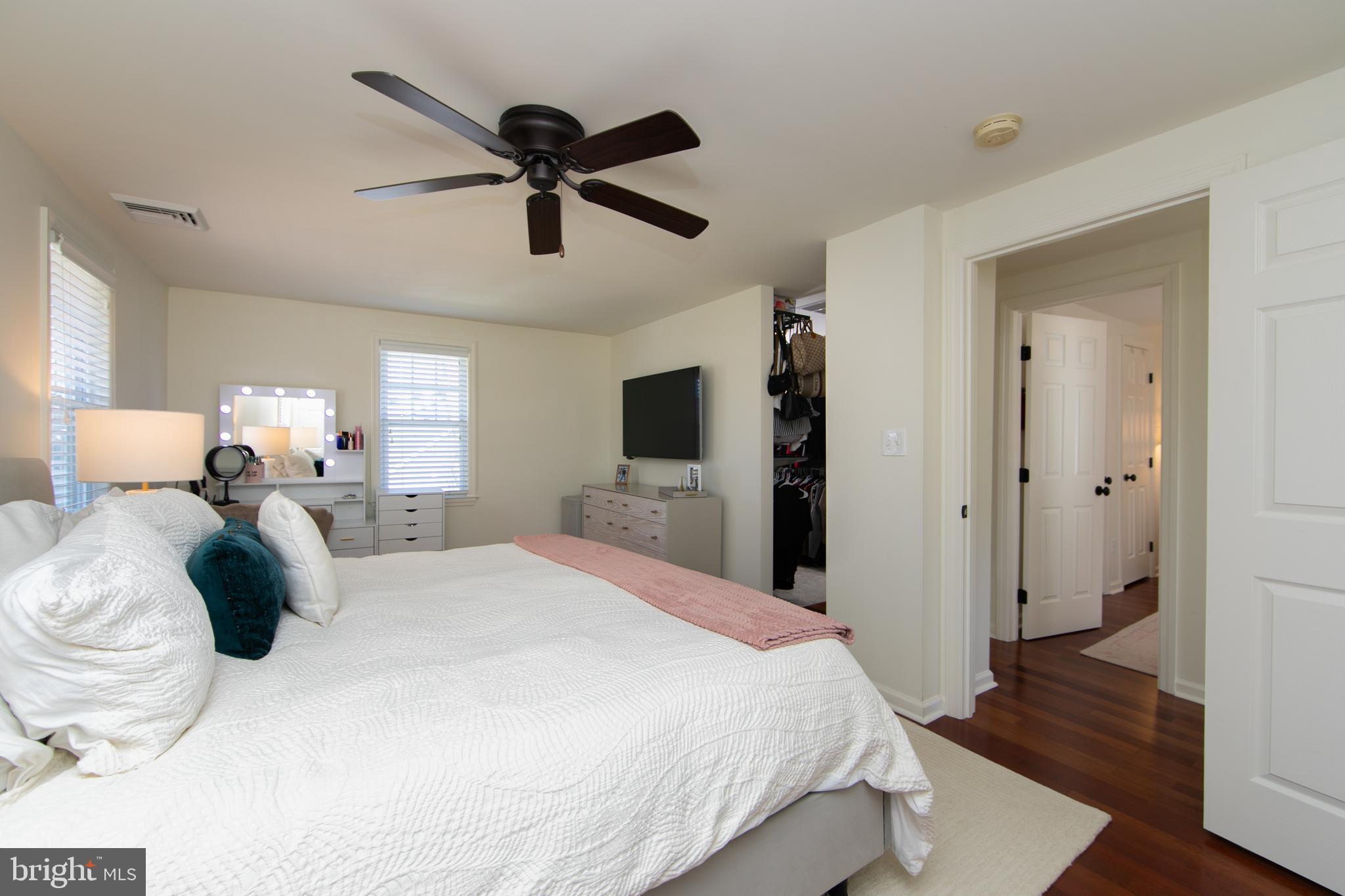 401 Spruce Street Haddonfield, NJ 08033 - Photo 26 of 40 a bedroom with a bed and wooden floor