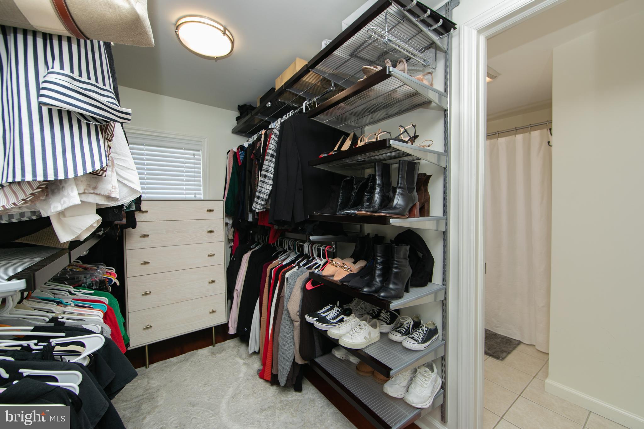 401 Spruce Street Haddonfield, NJ 08033 - Photo 28 of 40 a view of walk in closet with clothes and shoes