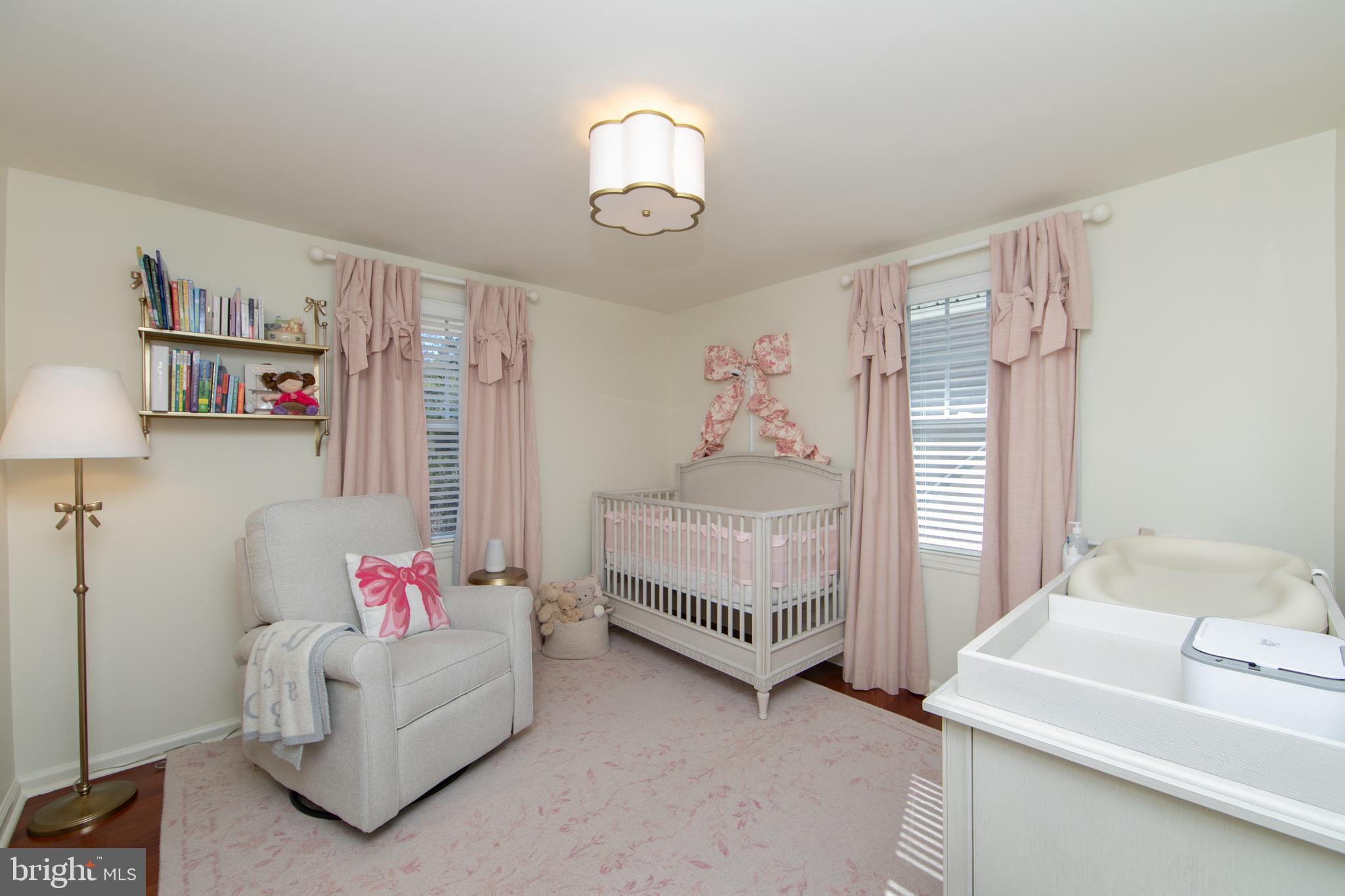 401 Spruce Street Haddonfield, NJ 08033 - Photo 30 of 40 a bedroom with furniture and a chandelier