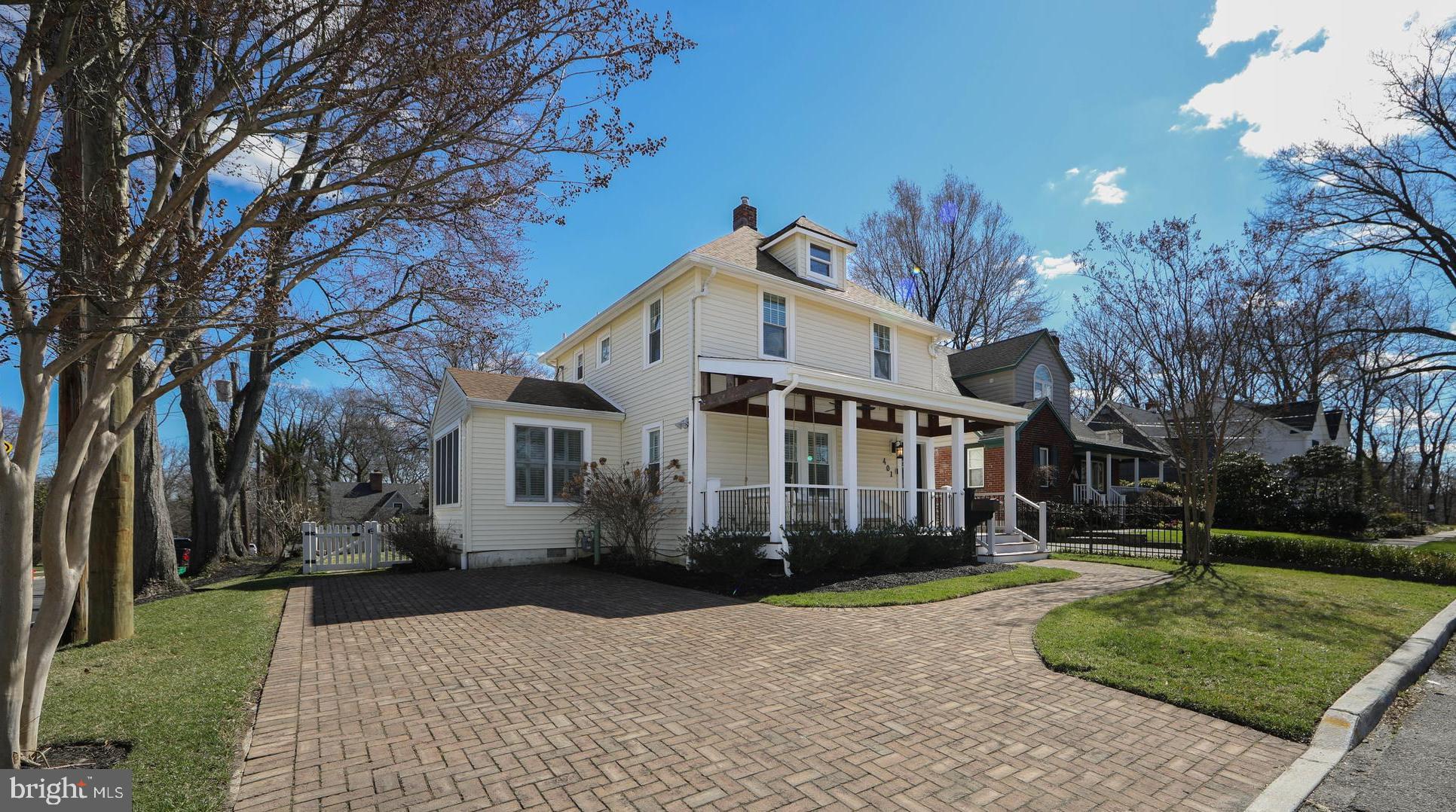 401 Spruce Street Haddonfield, NJ 08033 - Photo 3 of 40 a front view of a house with a garden