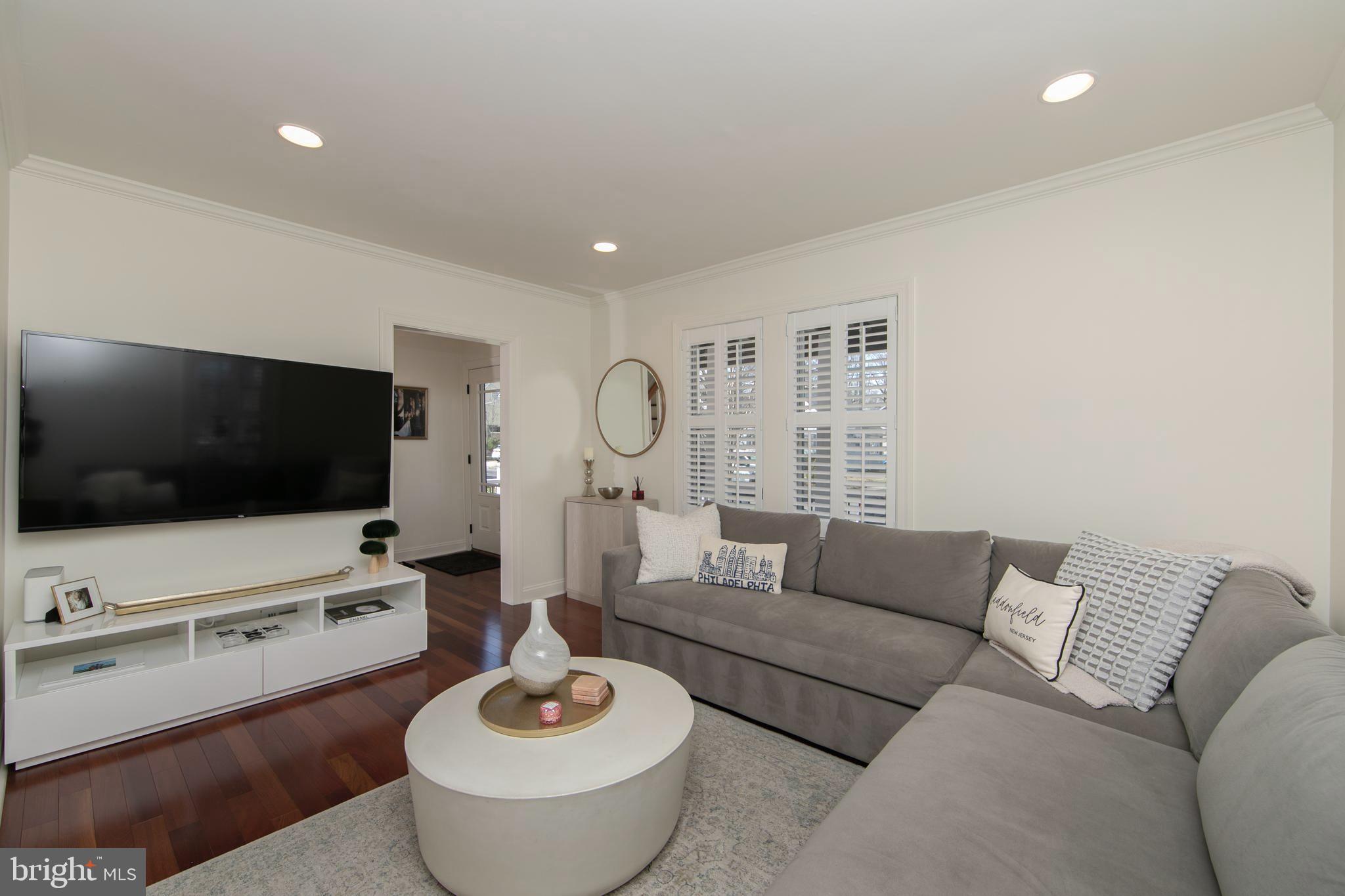 401 Spruce Street Haddonfield, NJ 08033 - Photo 9 of 40 a living room with furniture and a flat screen tv