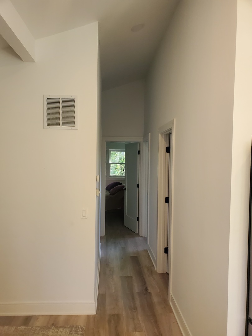 4-a94 Springfield Drive Apple River, IL 61001 - Photo 30 of 35 a view of a hallway with wooden floor and a bathroom