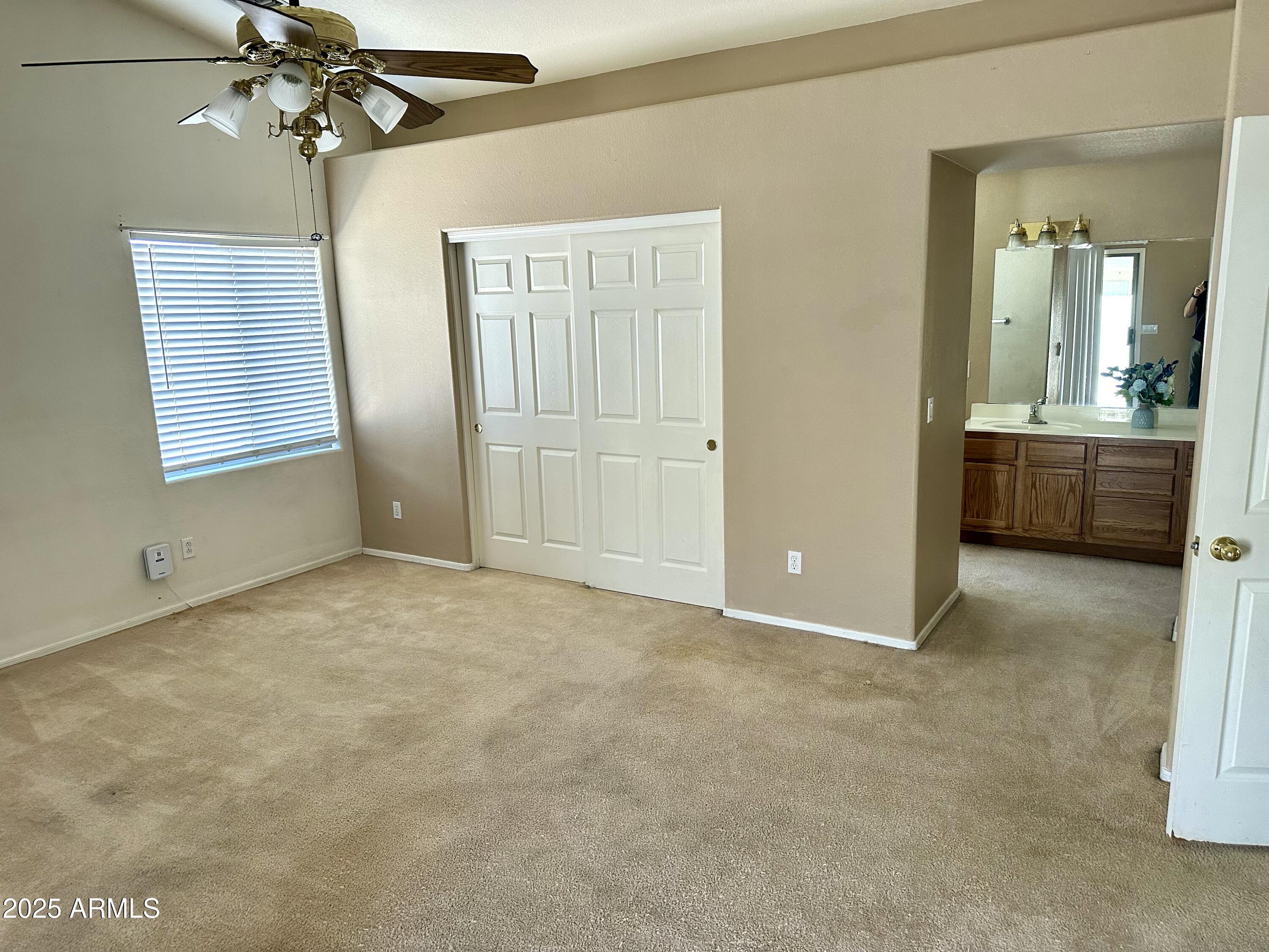 592 East 9th Avenue Apache Junction, AZ 85119 - Photo 14 of 19 a view of an empty room with a bathroom