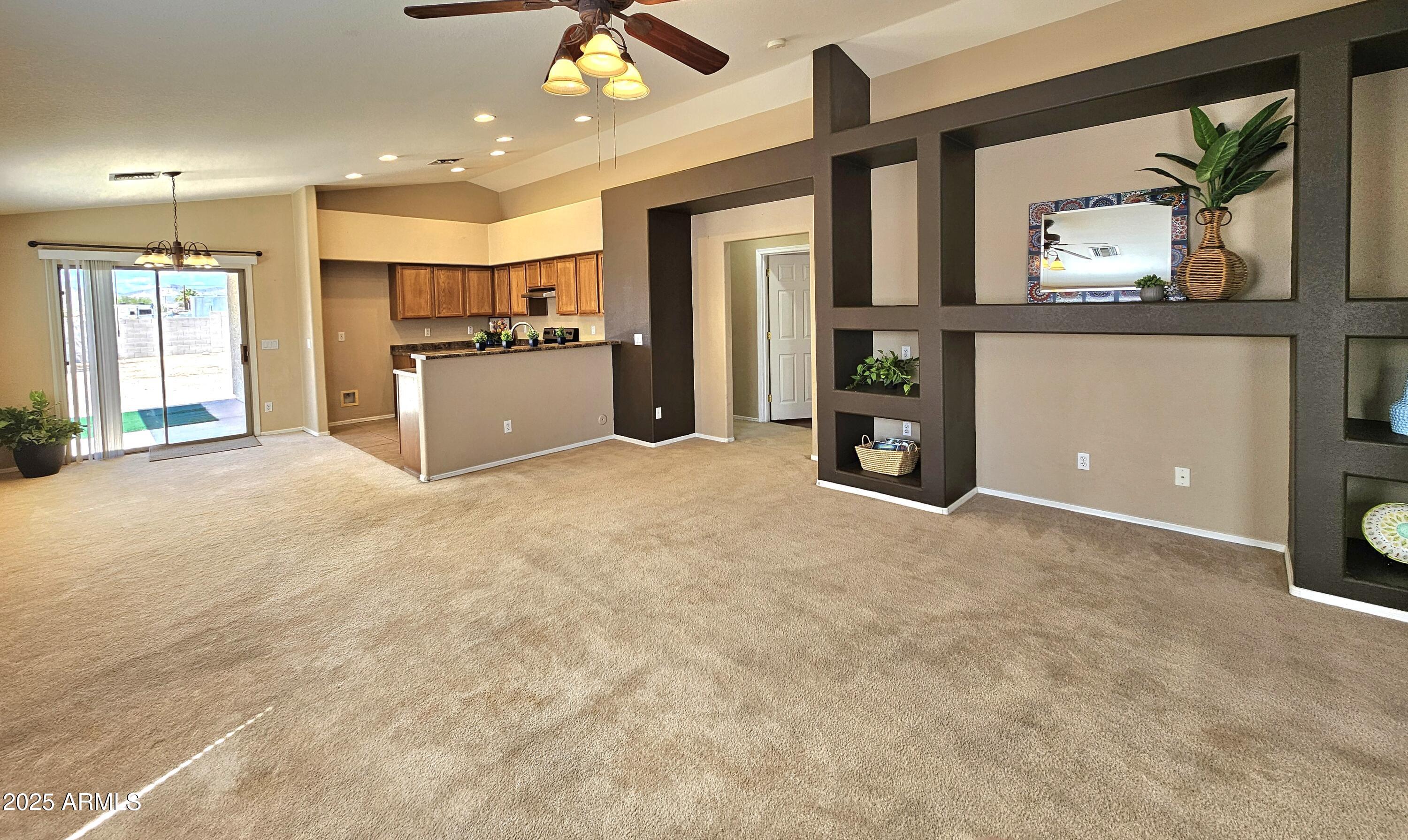 592 East 9th Avenue Apache Junction, AZ 85119 - Photo 3 of 19 a view of an empty room with a kitchen