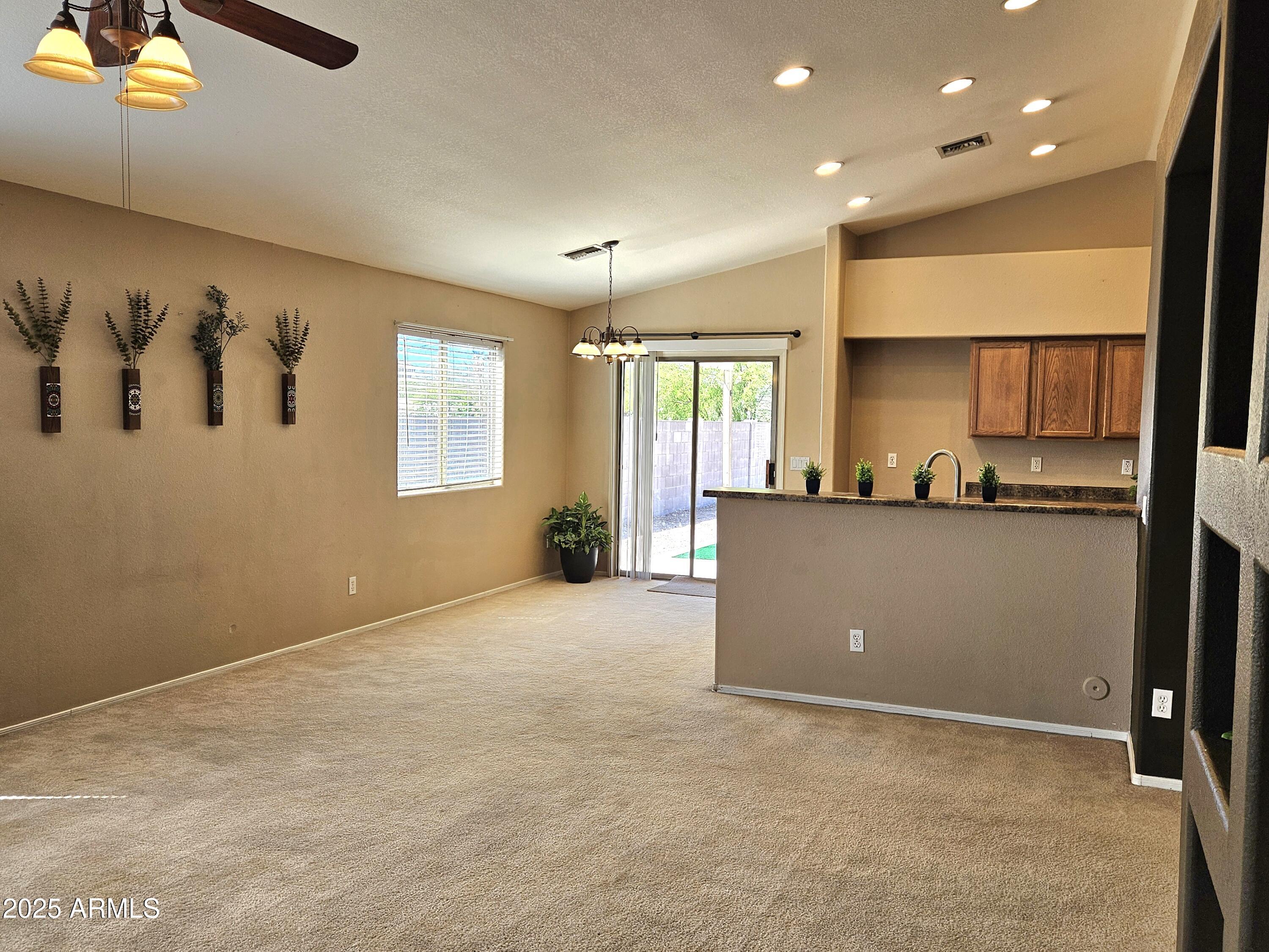 592 East 9th Avenue Apache Junction, AZ 85119 - Photo 4 of 19 a view of a kitchen with a sink and cabinets