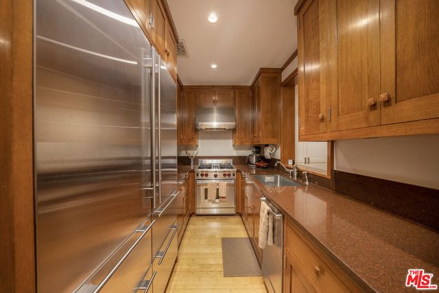 a dining room with furniture and garden view