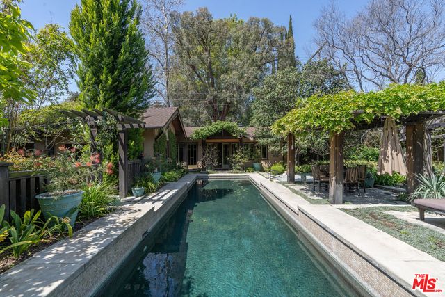 a view of a backyard of the house