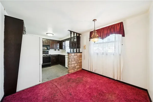 a kitchen with a sink cabinets and window