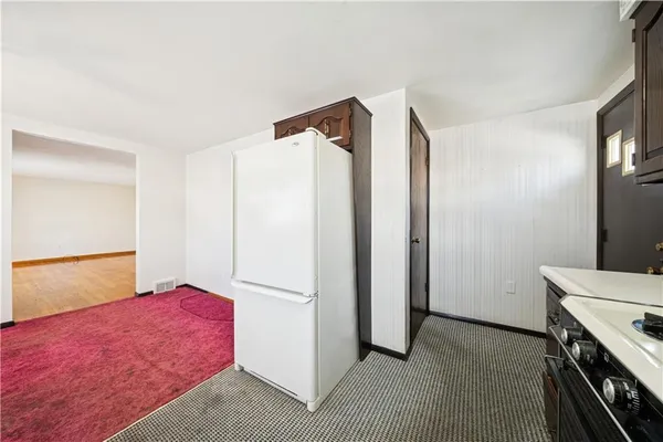 a view of wooden floor and windows in a room