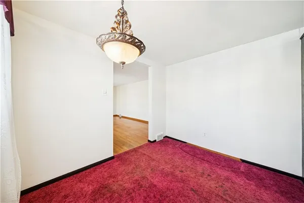 a bathroom with a sink mirror vanity and toilet