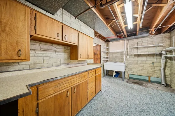 a kitchen with a sink and cabinets