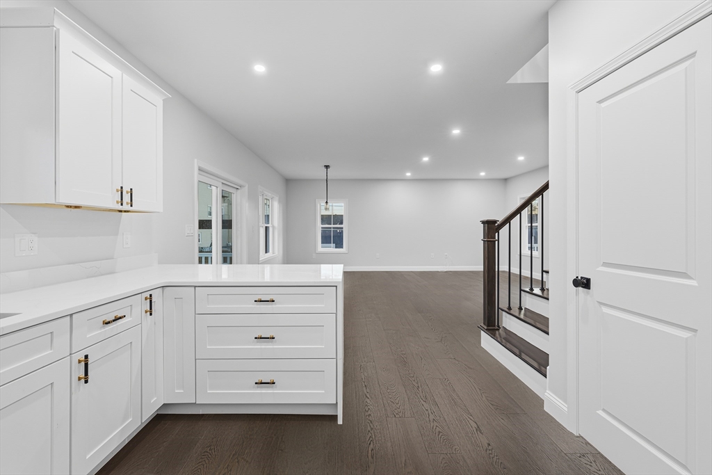 138 18th Street Fall River, MA 02723 - Photo 10 of 14 a kitchen with white cabinets and appliances