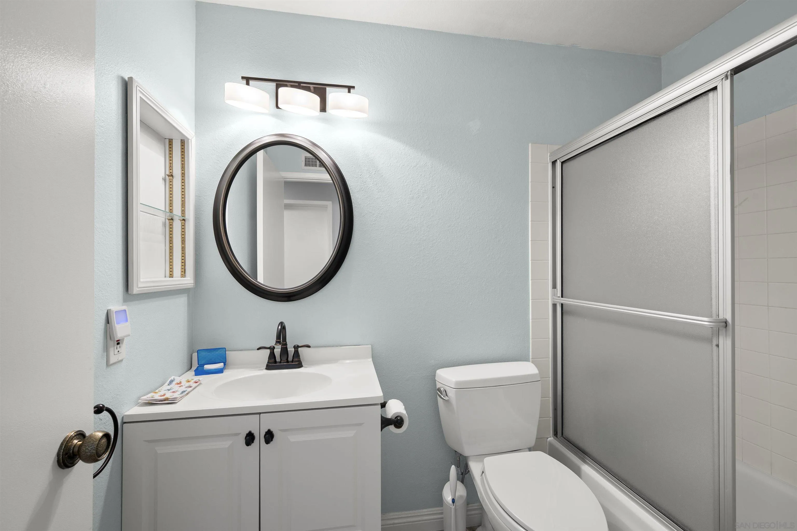 12679 Ridgeton Drive Lakeside, CA 92040 - Photo 22 of 33 a bathroom with a toilet sink and mirror