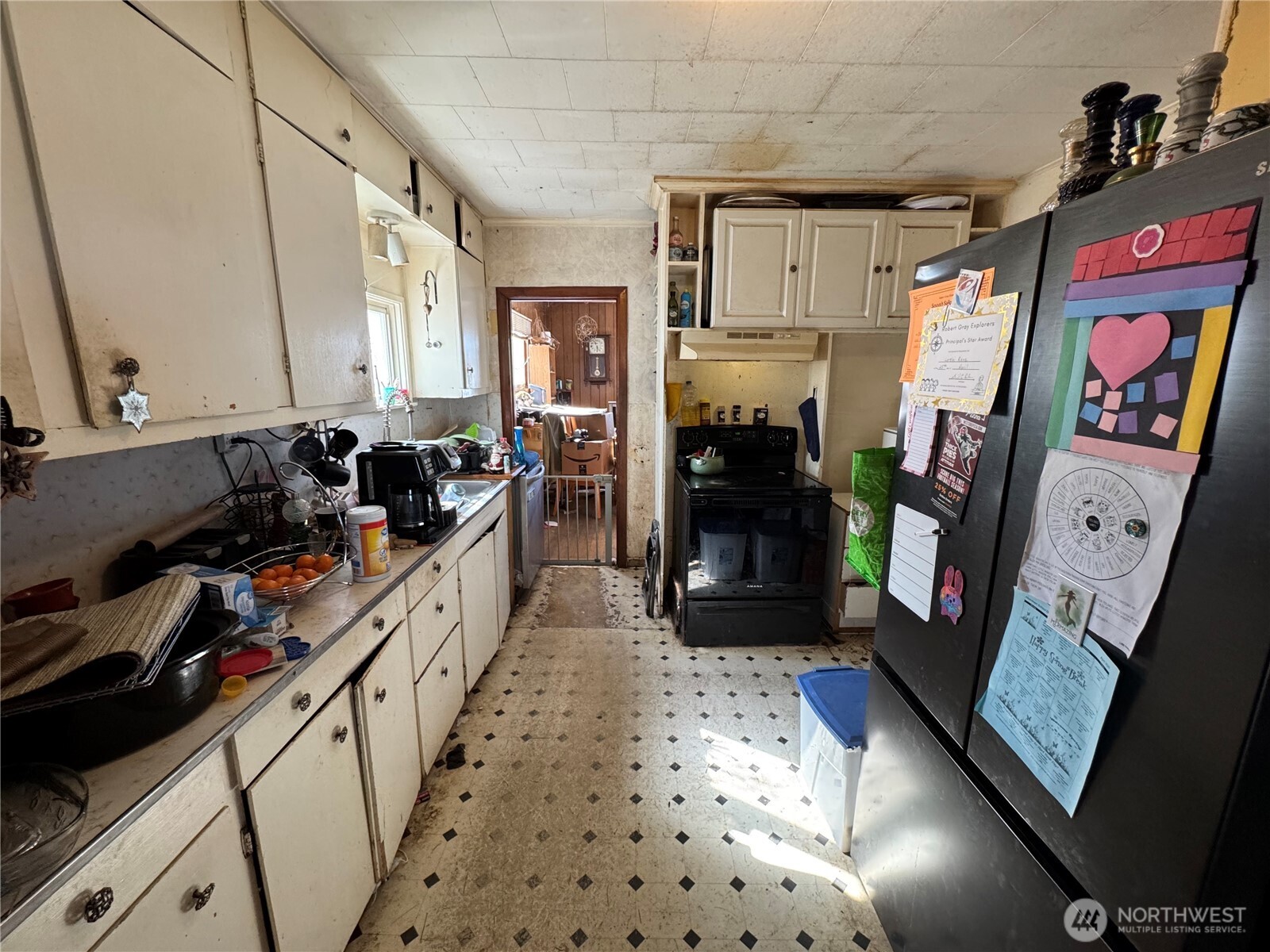 1029 Cleveland Street Aberdeen, WA 98520 - Photo 7 of 25 a kitchen with stainless steel appliances a stove refrigerator and cabinets