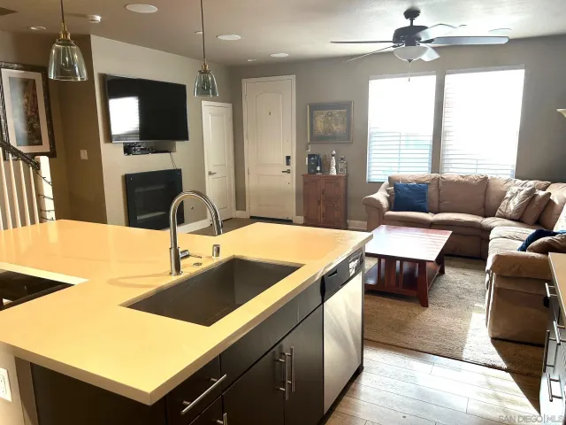 a kitchen with a stove a sink and a refrigerator