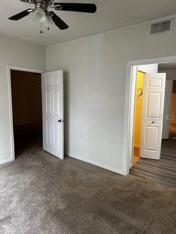 an empty room with a bathroom