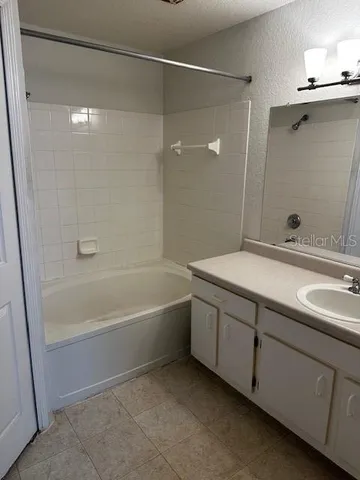 a bathroom with a bathtub and a sink