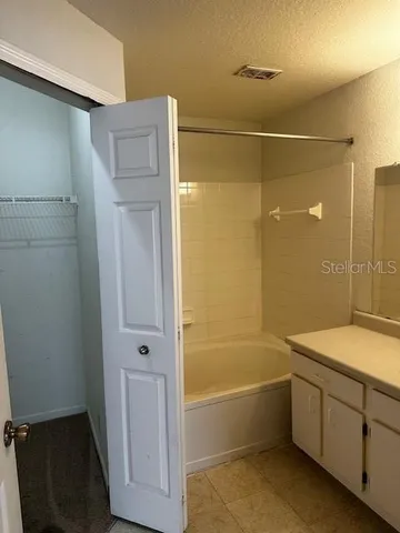 a bathroom with a bathtub and shower