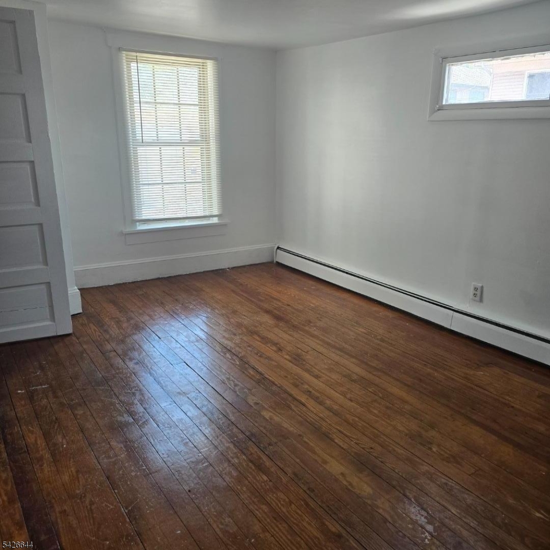 7 Central Avenue, Unit 7&9 High Bridge, NJ 08829 - Photo 2 of 8 an empty room with wooden floor and windows