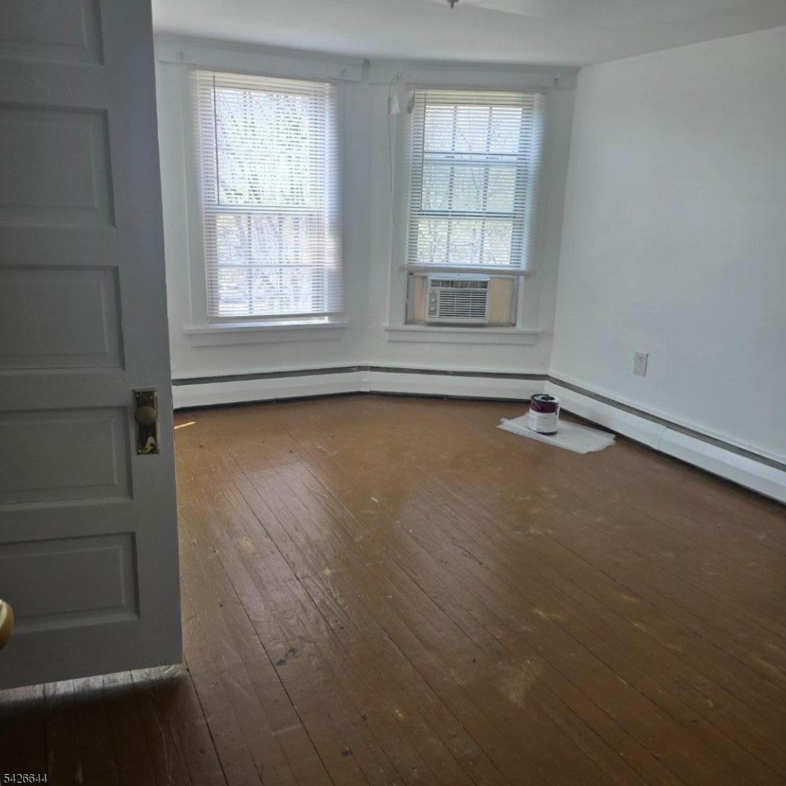 7 Central Avenue, Unit 7&9 High Bridge, NJ 08829 - Photo 3 of 8 an empty room with wooden floor and windows