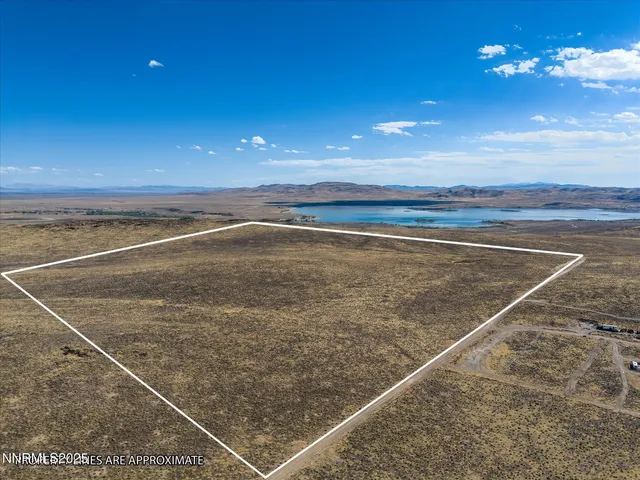 a view of an empty room with a chandelier