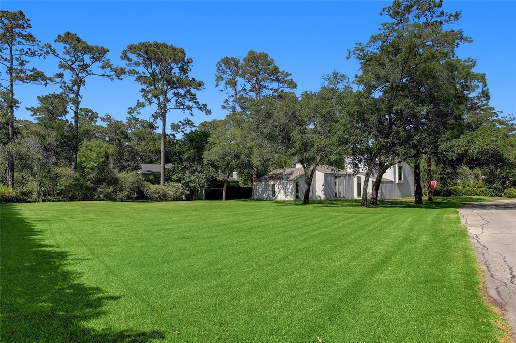 320 Blalock Road Piney Point Village, TX 77024 - Photo 9 of 22 a view of a grassy field with trees