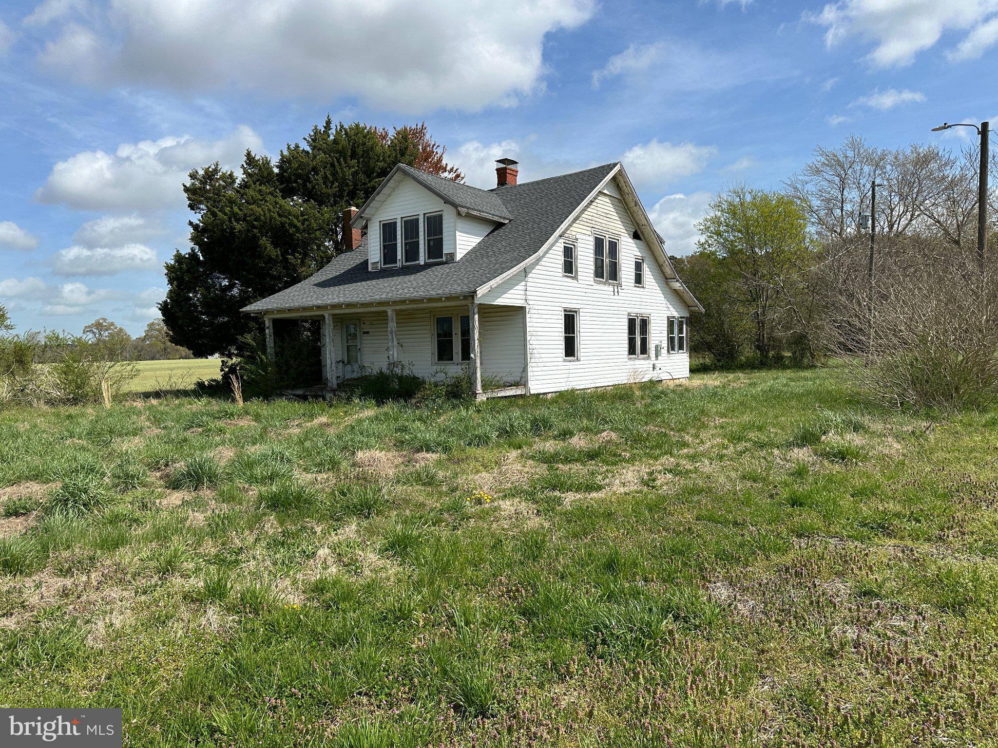 Charming farmhouse on sprawling land.