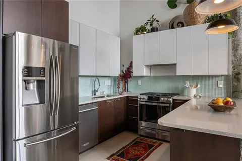 a kitchen with a sink and cabinets