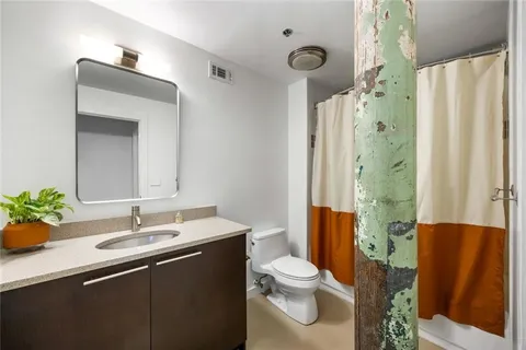 a bedroom with a bed and a walk in closet