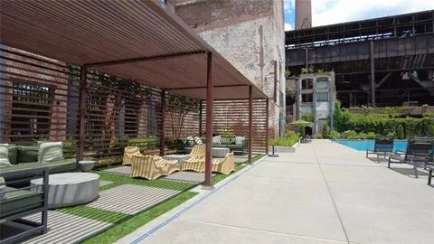 a view of a building with sitting area