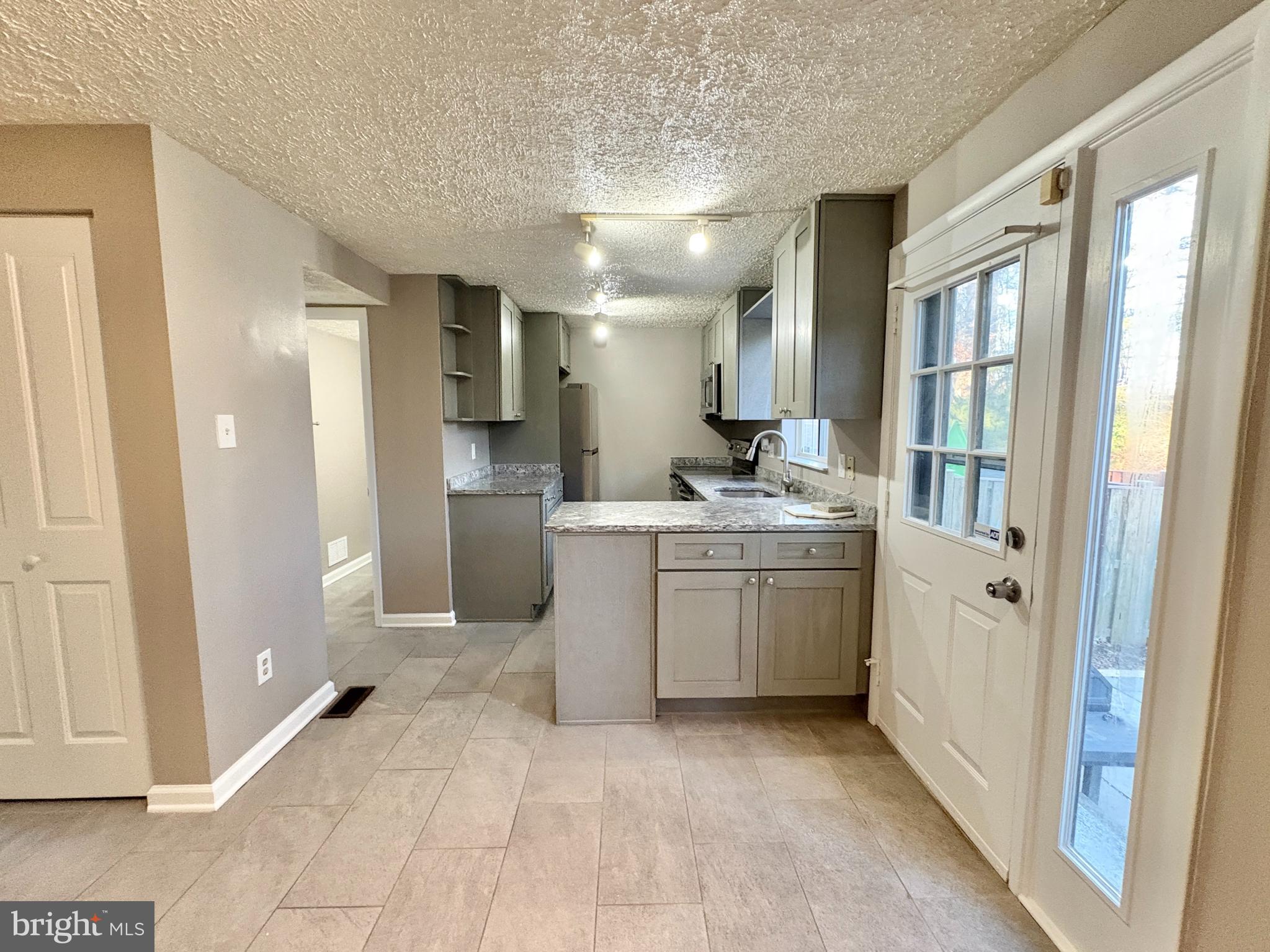 8263 Burning Forest Court Springfield, VA 22153 - Photo 12 of 43 a room with a washer and dryer