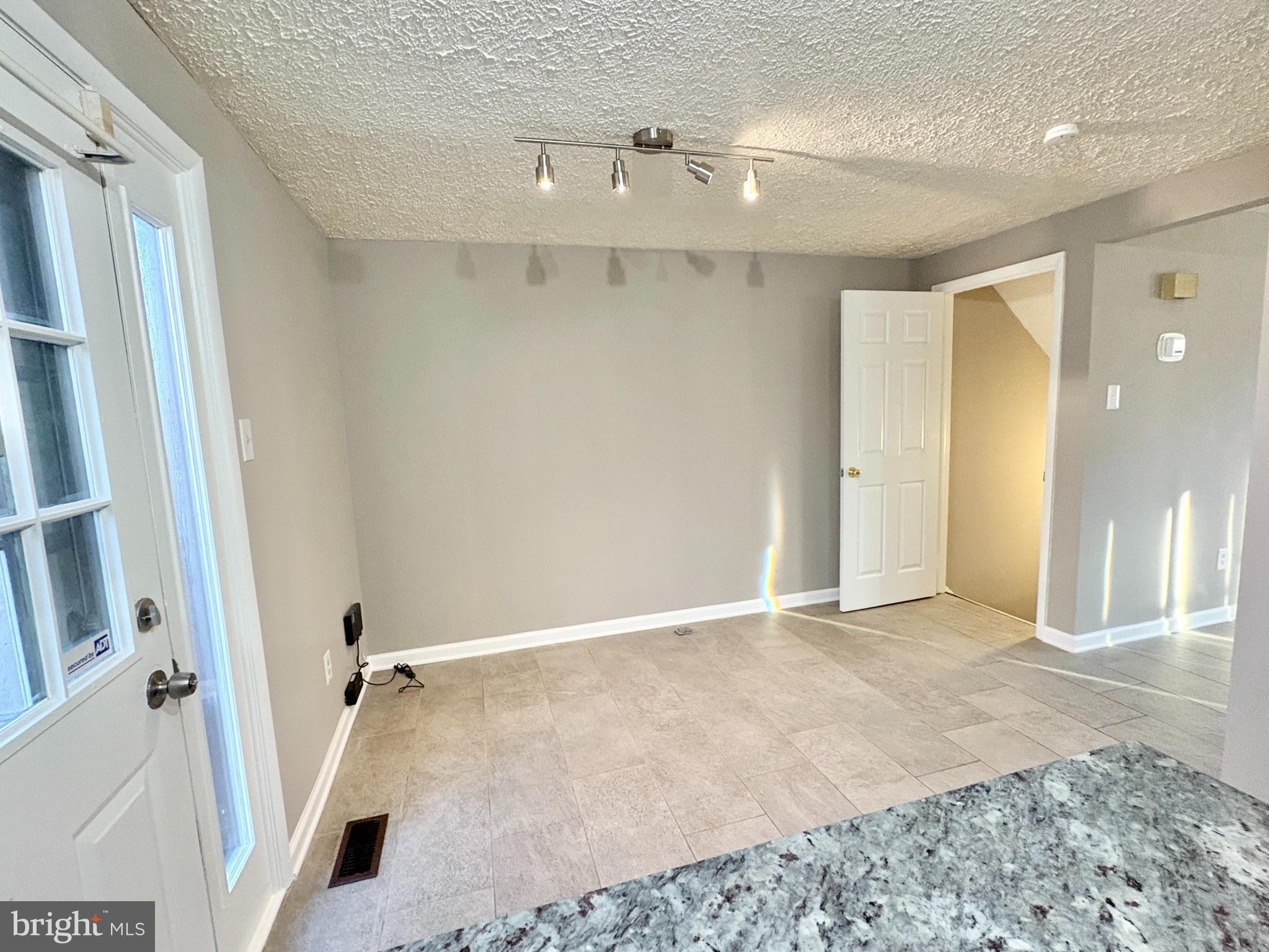 8263 Burning Forest Court Springfield, VA 22153 - Photo 13 of 43 a view of a hallway with wooden floor