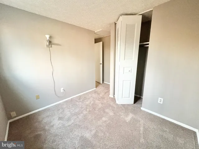 a view of a room with an empty space