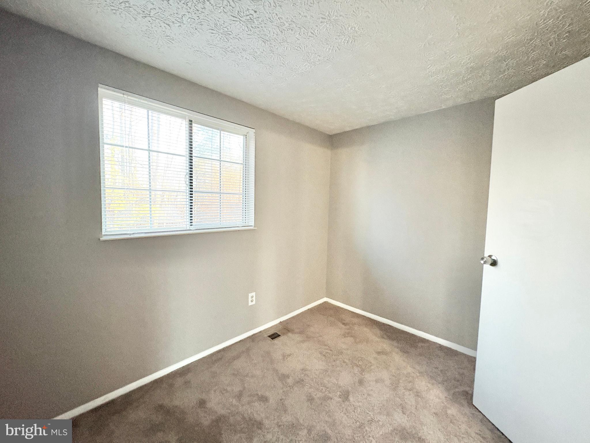 8263 Burning Forest Court Springfield, VA 22153 - Photo 23 of 43 an empty room with a window