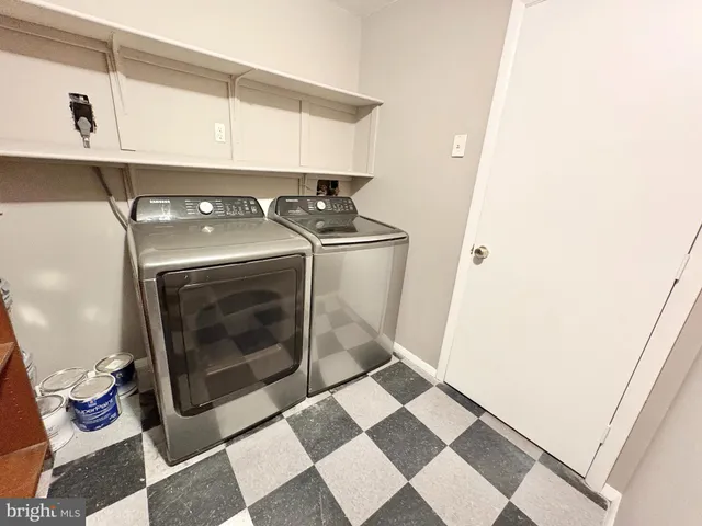 a stove top oven sitting inside of a kitchen