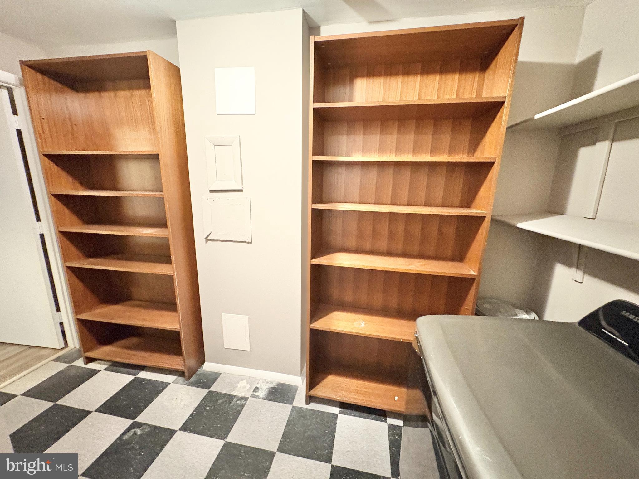 8263 Burning Forest Court Springfield, VA 22153 - Photo 33 of 43 a view of walk in closet with empty racks