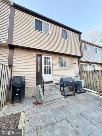 a view of a car park in front of house